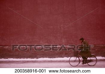 Stock Photography - man riding bicycle 
in snow, side 
view (soft focus). 
fotosearch - search 
stock photos, 
pictures, images, 
and photo clipart