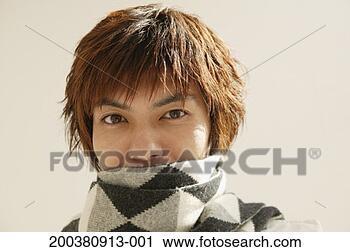 Stock Photography - portrait of young 
man, scarf covering 
mouth. fotosearch 
- search stock 
photos, pictures, 
images, and photo 
clipart