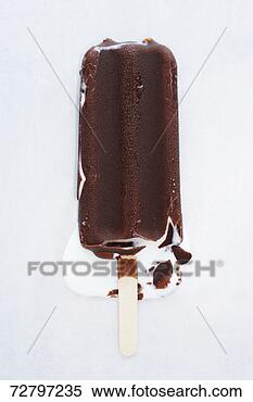 Stock Image - chocolate iced 
lolly melting, 
close-up. fotosearch 
- search stock 
photos, pictures, 
images, and photo 
clipart