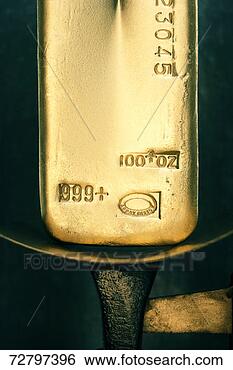 Stock Photo - gold ingot on 
weight scale. 
fotosearch - search 
stock photos, 
pictures, images, 
and photo clipart