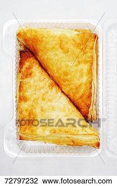 Stock Photo - two apple turnovers 
in plastic container, 
overhead view, 
close-up. fotosearch 
- search stock 
photos, pictures, 
images, and photo 
clipart