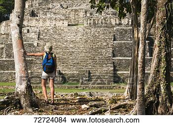Stock Photo - young woman watching 
maya archaeological 
site of lamanai. 
fotosearch - search 
stock photos, 
pictures, images, 
and photo clipart
