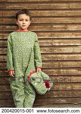 Stock Photography - boy (5-7) wearing 
crocodile costume, 
arms by side, 
portrait. fotosearch 
- search stock 
photos, pictures, 
images, and photo 
clipart