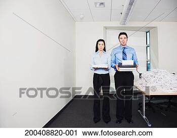 Stock Photography - businessman and 
businesswoman 
shredding paper, 
portrait. fotosearch 
- search stock 
photos, pictures, 
images, and photo 
clipart