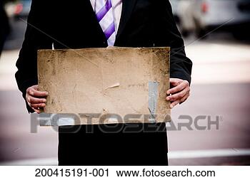 Stock Photography - businessman holding 
blank cardboard 
sign, mid section. 
fotosearch - search 
stock photos, 
pictures, images, 
and photo clipart