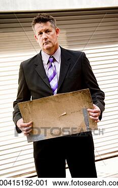 Stock Photography - businessman holding 
blank cardboard 
sign, portrait. 
fotosearch - search 
stock photos, 
pictures, images, 
and photo clipart