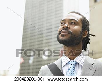 Stock Photography - businessman looking 
in distance. fotosearch 
- search stock 
photos, pictures, 
images, and photo 
clipart