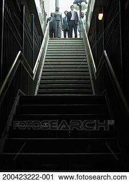 Stock Photography - businessmen and 
woman  standing 
at entrance to 
subway station. 
fotosearch - search 
stock photos, 
pictures, images, 
and photo clipart