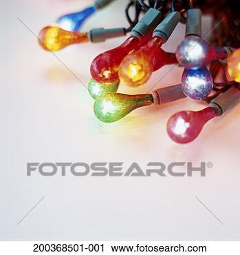 Stock Photography - coloured fairy 
lights on white 
background, close 
up (soft focus). 
fotosearch - search 
stock photos, 
pictures, images, 
and photo clipart