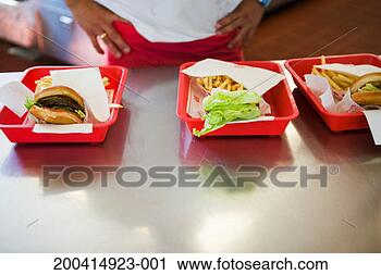 Stock Photography - counterperson 
at fast food restaurant, 
mid section. fotosearch 
- search stock 
photos, pictures, 
images, and photo 
clipart