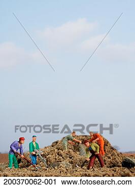 Stock Photography - male figurines 
working in sand, 
close up. fotosearch 
- search stock 
photos, pictures, 
images, and photo 
clipart