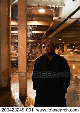 Stock Photography - mature man standing 
under elevated 
subway tracks. 
fotosearch - search 
stock photos, 
pictures, images, 
and photo clipart