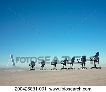 Stock Photography - office chairs 
and easel on concrete 
plain (digital 
composite). fotosearch 
- search stock 
photos, pictures, 
images, and photo 
clipart