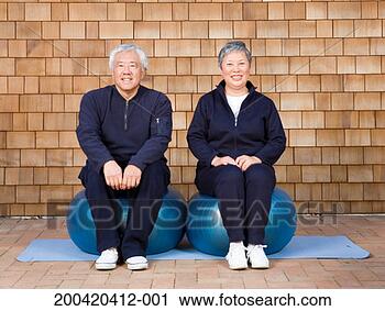 Stock Photography - senior couple 
sitting on blue 
exercise balls. 
fotosearch - search 
stock photos, 
pictures, images, 
and photo clipart
