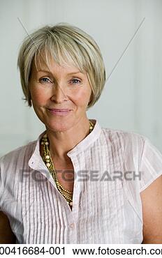 Stock Photography - senior woman smiling, 
portrait, close-up 
(focus on woman). 
fotosearch - search 
stock photos, 
pictures, images, 
and photo clipart