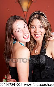 Stock Photography - two teenage girls 
(13-15) wearing 
formal dresses, 
portrait. fotosearch 
- search stock 
photos, pictures, 
images, and photo 
clipart
