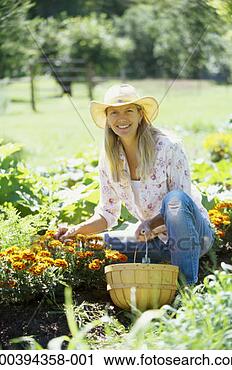 Stock Photography - woman with basket 
in flower garden, 
portrait, summer. 
fotosearch - search 
stock photos, 
pictures, images, 
and photo clipart