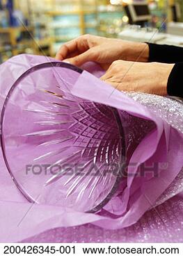 Stock Photography - woman wrapping 
vase, close-up. 
fotosearch - search 
stock photos, 
pictures, images, 
and photo clipart