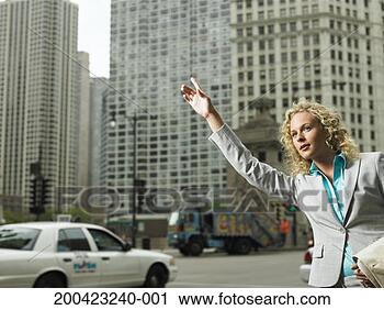 Stock Photography - young businesswoman 
hailing for taxi. 
fotosearch - search 
stock photos, 
pictures, images, 
and photo clipart