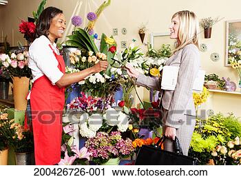 Stock Photography - young woman shopping 
for flowers in 
floral shop. fotosearch 
- search stock 
photos, pictures, 
images, and photo 
clipart