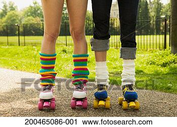 Stock Photography - two young women 
wearing roller 
skates, low section. 
fotosearch - search 
stock photos, 
pictures, images, 
and photo clipart