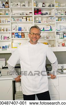 Stock Photography - vet standing in 
examination room, 
smiling. fotosearch 
- search stock 
photos, pictures, 
images, and photo 
clipart