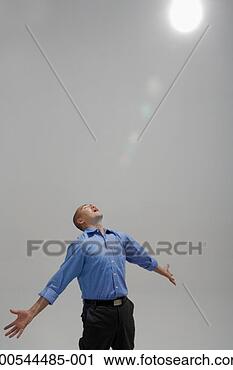 Stock Photography - business opening 
up to heavenly 
light, studio 
shot. fotosearch 
- search stock 
photos, pictures, 
images, and photo 
clipart