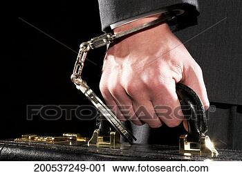 Stock Photography - businessman hand 
cuffed to briefcase, 
close-up. fotosearch 
- search stock 
photos, pictures, 
images, and photo 
clipart