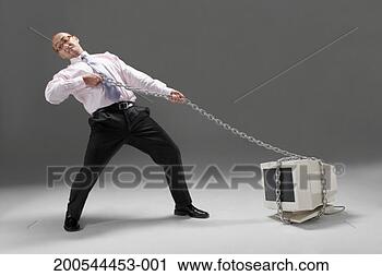 Stock Photography - businessman pulling 
old technology 
with chain, studio 
shot. fotosearch 
- search stock 
photos, pictures, 
images, and photo 
clipart