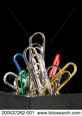 Stock Photography - colored paper 
clips sticking 
out of holder. 
fotosearch - search 
stock photos, 
pictures, images, 
and photo clipart