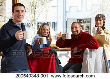 Stock Photography - four adults holding 
coffee cups in 
cafe, smiling, 
portrait. fotosearch 
- search stock 
photos, pictures, 
images, and photo 
clipart