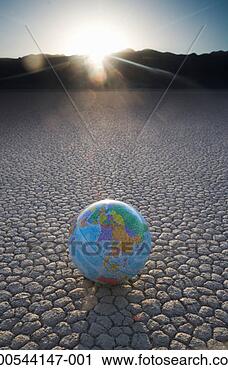 Stock Photography - globe on cracked 
earth. fotosearch 
- search stock 
photos, pictures, 
images, and photo 
clipart
