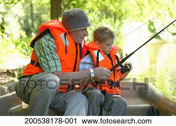 Stock Photography - grandfather and 
grandson (6-8) 
fishing from boat. 
fotosearch - search 
stock photos, 
pictures, images, 
and photo clipart