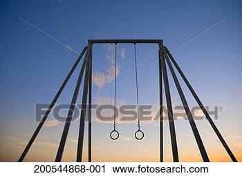 Stock Photography - gymnastics rings 
against blue sky 
at dusk. fotosearch 
- search stock 
photos, pictures, 
images, and photo 
clipart