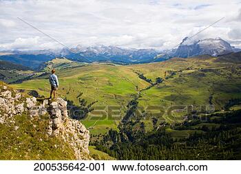Stock Photography - italy, trentino-alto 
adige, alto adige, 
male hiker on 
ridge, rear view. 
fotosearch - search 
stock photos, 
pictures, images, 
and photo clipart