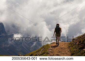 Stock Photography - italy, trentino-alto 
adige, alto adige, 
dolomites, woman 
hiking. fotosearch 
- search stock 
photos, pictures, 
images, and photo 
clipart
