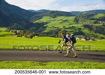 Stock Photography - italy, trentino-alto 
adige, alto adige, 
two hikers near 
fie and vols. 
fotosearch - search 
stock photos, 
pictures, images, 
and photo clipart