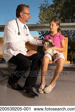 Stock Photography - male vet sitting 
with girl (9-11) 
holding rabbit 
in waiting room. 
fotosearch - search 
stock photos, 
pictures, images, 
and photo clipart