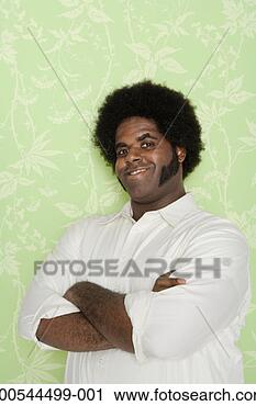 Stock Photography - man with arms 
crossed, smiling, 
portrait. fotosearch 
- search stock 
photos, pictures, 
images, and photo 
clipart