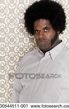 Stock Photography - man making a face, 
indoors, portrait. 
fotosearch - search 
stock photos, 
pictures, images, 
and photo clipart