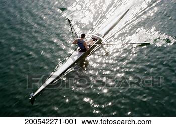 Stock Photography - man rowing single 
scull, elevated 
view (blurred 
motion). fotosearch 
- search stock 
photos, pictures, 
images, and photo 
clipart