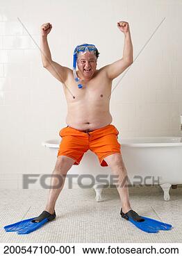 Stock Photography - man wearing snorkelling 
equipment in bathroom, 
cheering, portrait. 
fotosearch - search 
stock photos, 
pictures, images, 
and photo clipart