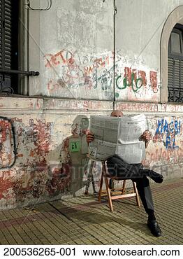 Stock Photography - mature man sitting 
against wall with 
graffiti reading 
newspaper. fotosearch 
- search stock 
photos, pictures, 
images, and photo 
clipart