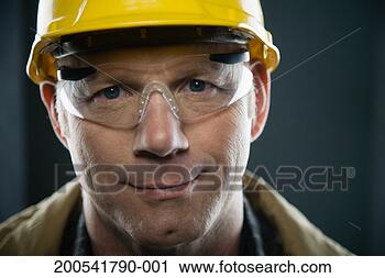 Stock Photography - mature man wearing 
hardhat and protective 
eyewear, portrait. 
fotosearch - search 
stock photos, 
pictures, images, 
and photo clipart