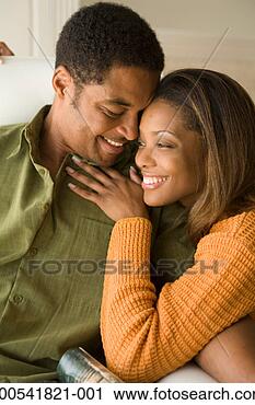 Stock Photography - mature man and 
young woman embracing 
and smiling. fotosearch 
- search stock 
photos, pictures, 
images, and photo 
clipart