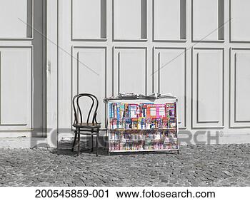 Stock Photography - newspaper stand 
and empty chair 
in street. fotosearch 
- search stock 
photos, pictures, 
images, and photo 
clipart