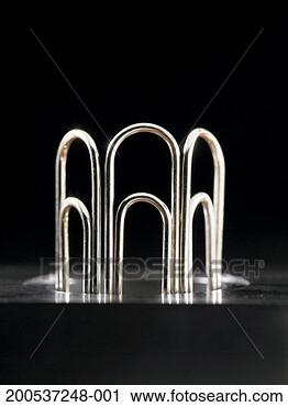 Stock Photography - paper clips sticking 
out of holder. 
fotosearch - search 
stock photos, 
pictures, images, 
and photo clipart