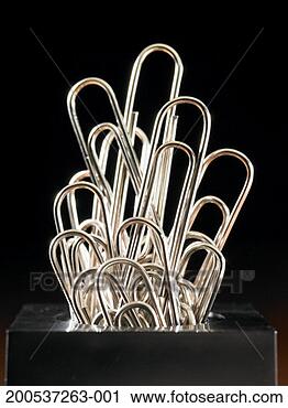 Stock Photography - paper clips sticking 
out of holder. 
fotosearch - search 
stock photos, 
pictures, images, 
and photo clipart