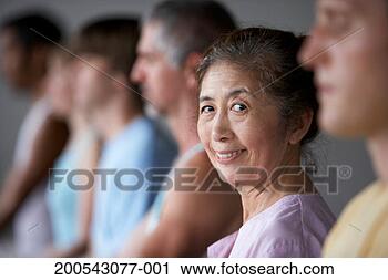 Stock Photography - people in yoga 
class (focus on 
senior woman smiling). 
fotosearch - search 
stock photos, 
pictures, images, 
and photo clipart