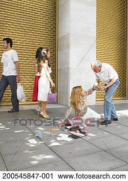 Stock Photography - senior man helping 
woman fallen on 
street. fotosearch 
- search stock 
photos, pictures, 
images, and photo 
clipart